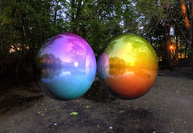 A raytraced environment mapping example with colored reflective balls.