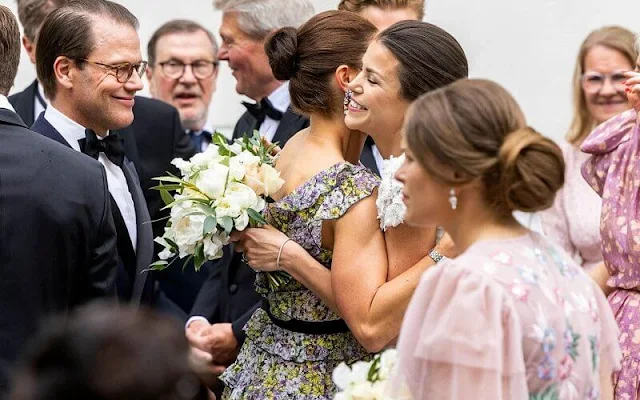 Crown Princess Victoria wore a floral print chiffon dress by Giambattista Valli x H&M. Shourouk Mia earrings