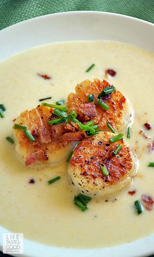 Pan-Seared Scallops with Corn Puree | by Life Tastes Good is a delicious meal that is on the table in about 30 minutes. It is special enough to serve to guests or when you want to enjoy a date night at home. The perfectly seared scallops over creamy corn puree topped off with a little crispy bacon is irresistible!