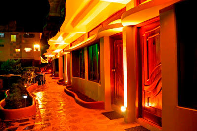 Galapagos Eco Lodge lit at night by wind driven ecological power source