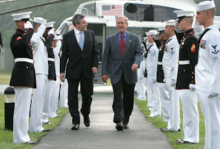 President George W. Bush and Prime Minister Gordon Brown of the United Kingdom, walk past an honor guard Sunday, July 29, 2007, after the Prime Minister's arrival at Camp David in Thurmont, Maryland. White House photo by Chris Greenberg