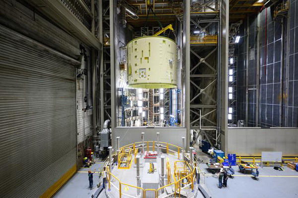 The intertank for the third Space Launch System core stage booster is lifted into the air at NASA's Michoud Assembly Facility in New Orleans, Louisiana...on May 30, 2023.