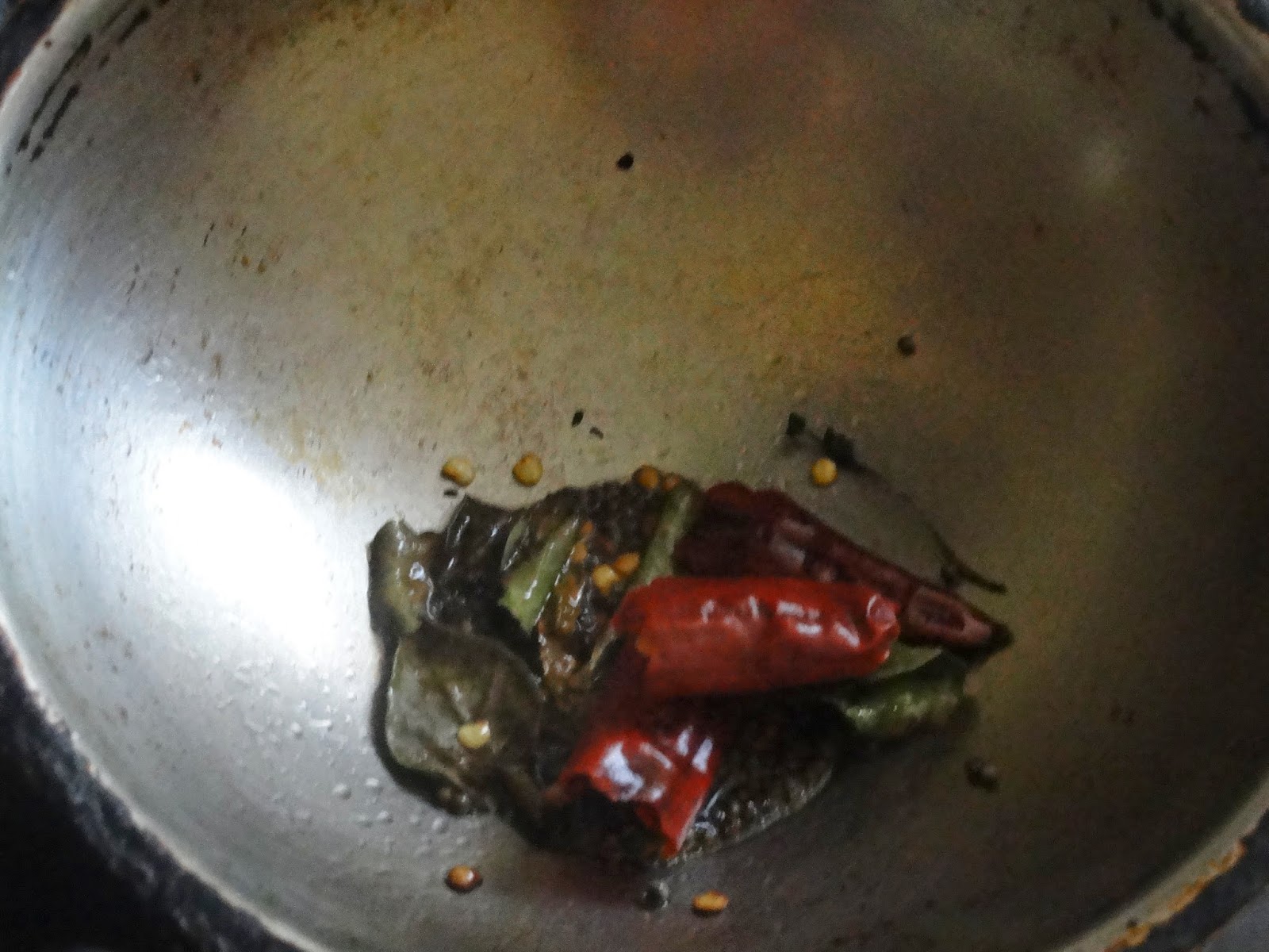 Add curry leaves and red chili to the tempering