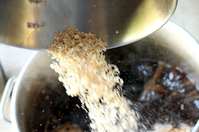 Half a pound of flaked oats going into the boil.