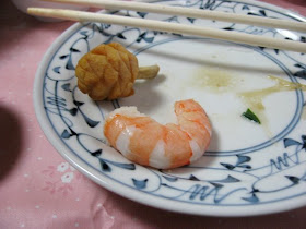 A tiny carved squash and a single shrimp from the osechi for New Year's at Morinaga-san's house.