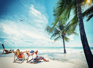 two businessmen relaxing on the beach