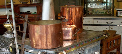 Copper pots and 19th-century stoves in good working order (detail).