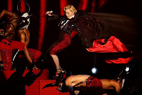 Singer Madonna falls during her performance at the BRIT music awards.