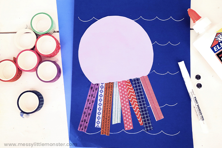 Add washi tape to octopus craft for kids