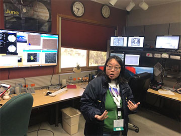 Dr. Karen Kinemuchi, AAVSO and NMSU, explains the 3.5 meter telescope control room (Source: Palmia Observatory)