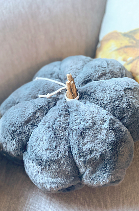 grey fuzzy pumpkin pillow with stem