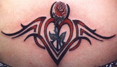 Tribal sign tattoo with red heart and rose