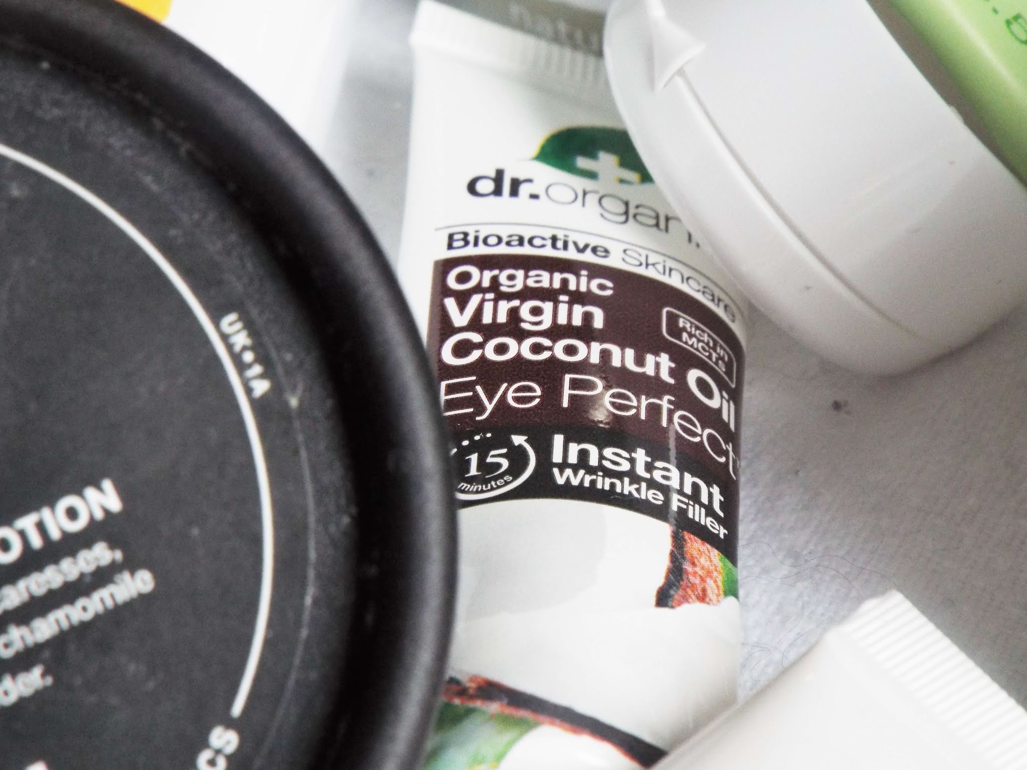 Dr Organic Virgin Coconut Oil Eye Perfect, in white, small squeezy tube packaging, with coconut label.