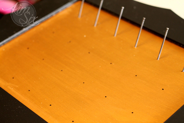 DIY spool organizer from nails