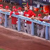 Cardinals' dugout try to make cop laugh