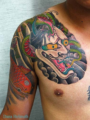 foo dog and geisha Japanese tattoo sleeve in black and grey. Japanese Tattoo