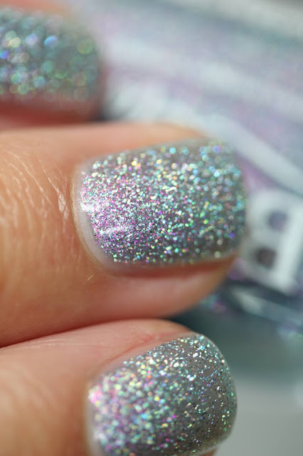 Blue holographic nail polish with pink shimmer