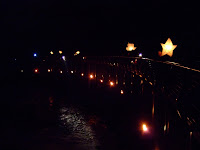 Lantern procession crossing the Millennium Walkway