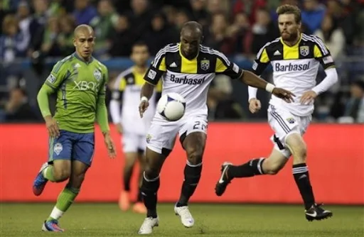 Columbus Crew forward Emilio Rentería kicks the ball to score against Seattle Sounders