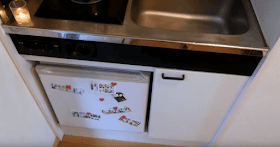 08-Fridge-and-cupboard-Emma-8m²-Tiny-Apartment-in-Tokyo-Japan-www-designstack-co