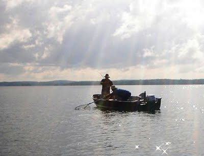 landing a fish on Red Lake, Ontario