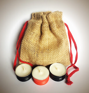 Jute gift bag of upcycled wine bottle cap candles