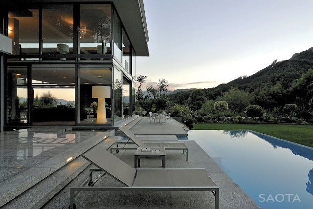 Picture of large modern terrace between the pool and the house