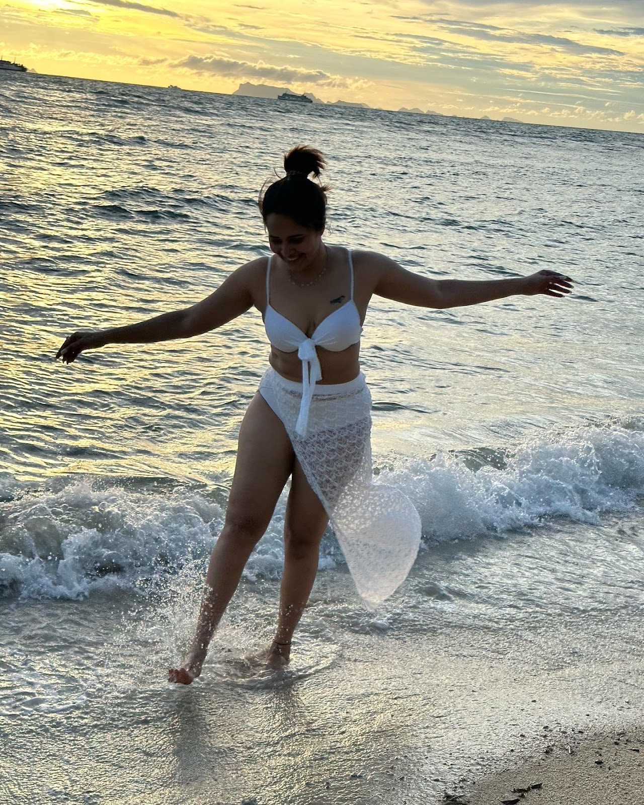Anasuya Bharadwaj white bikini curvy cleavage navel