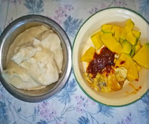 banku with fried egg, shitor and pear