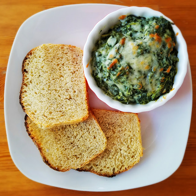 Spinach and artichoke dip with sliced homemade bread