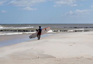 SUPsurfer on polish beach