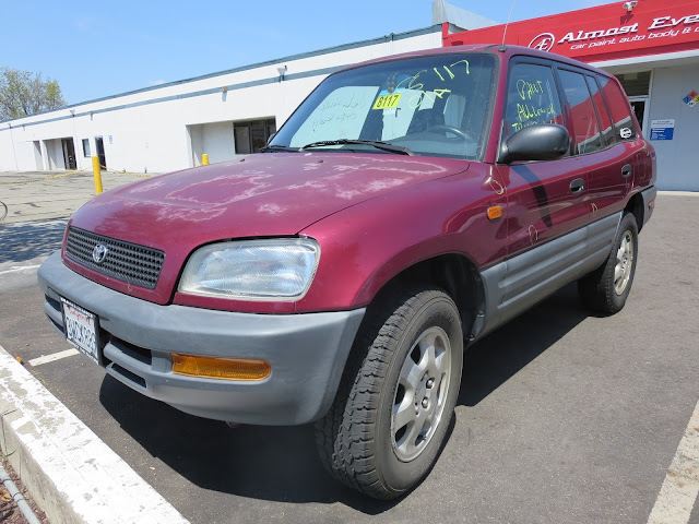 97 RAV4 with delaminating paint & dents prior to repair & painting at Almost Everything Auto Body