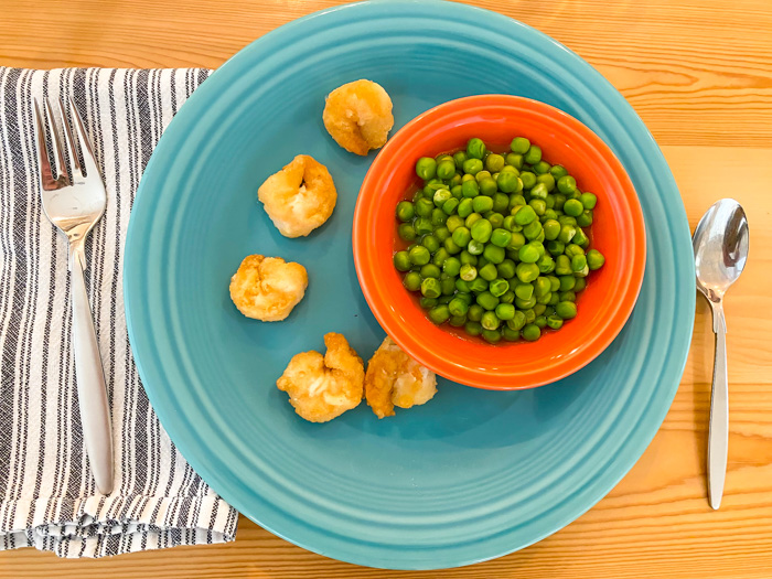 Trader Joe's Gluten-Free Breaded Shrimp on plate with side of peas