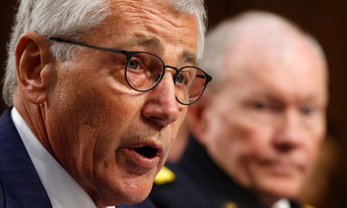 U.S. Secretary of Defense Chuck Hagel (L) and Chairman of the Joint Chiefs of Staff General Martin Dempsey testify during the Senate Armed Services Committee hearing on the U.S. policy toward Iraq and Syria and the threat posed by the Islamic State,� on Capitol Hill in Washington September 16, 2014. REUTERS/Kevin Lamarque (UNITED STATES - Tags: POLITICS MILITARY)