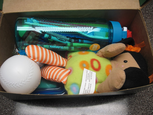 Toys and school supplies added to an OCC shoebox.