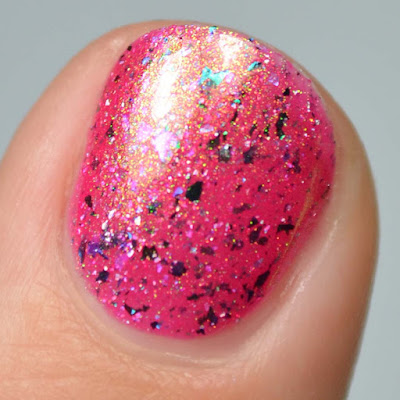 magenta nail polish with shimmer and flakies swatch