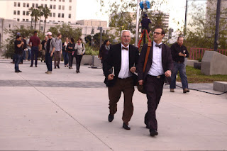 walk in formal attrie walk with city hall in background