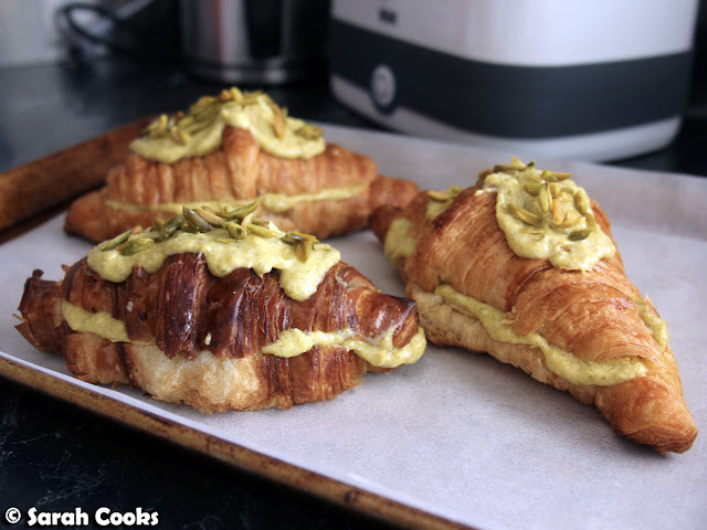Filled and topped pistachio croissants