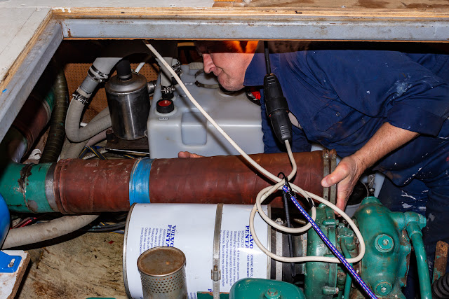 Photo of Phil refitting the exhaust elbow