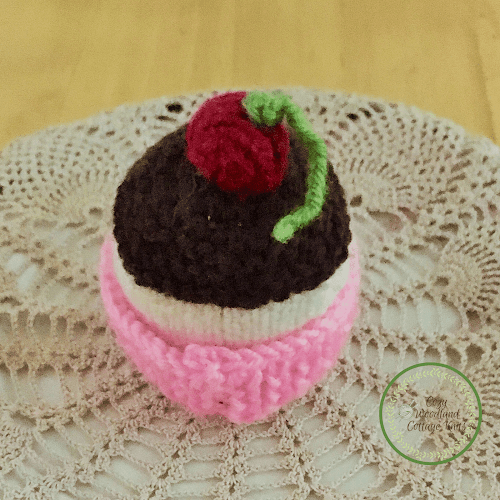 Picture of a knitted cherry cupcake