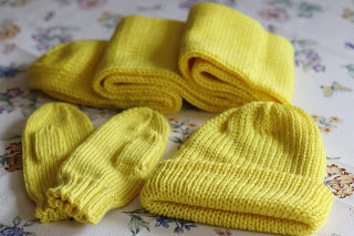 yellow knit hat, mittens, and scarf set