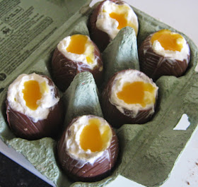 The cheesecake mixture and passion fruit yolks in the chocolate eggs