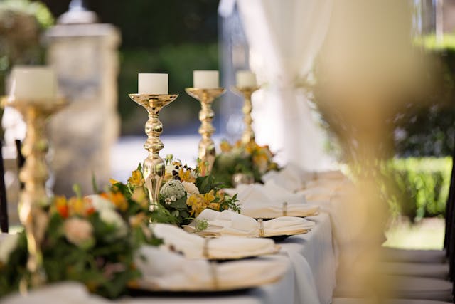 A wedding table with candles and napkins