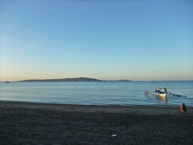 early morning view of the beach the sea Illin Island and Ambulong Island from Sikatuna Beach Resort in San Jose Occidental Mindoro