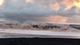 crashing waves at black sand beach