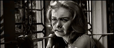 Janette Scott as Eleanor Ashby looks distraught by a window