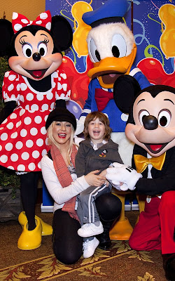 Christina Aguilera and Max celebrating at Disneyland