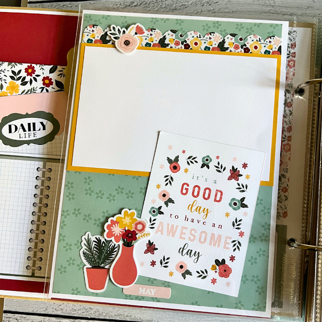 A Year in Review Scrapbook Album Page with flowers, plants, and a photo mat