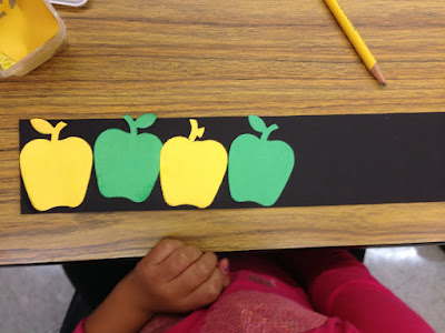 Make pattern using apple die cuts and black paper for a fun math activity