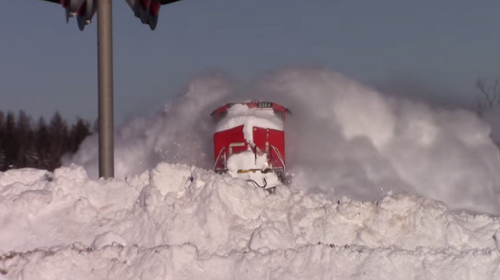 In Salisbury, New Brunswick A Train Creates A Spectacular Display As It Plows Through Snow.
